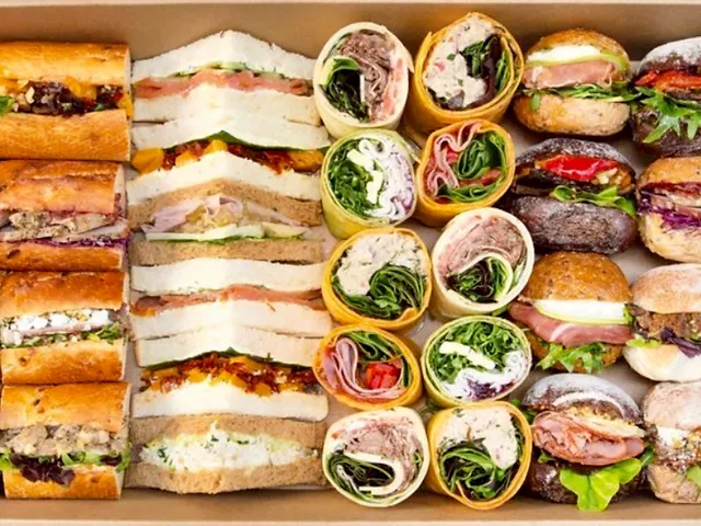Delicious Sandwich and Wrap Platter - Popular choice for Funeral Catering! Explore our exquisite assortment of mouth-watering sandwiches and wraps, beautifully arranged for your buffet catering needs. Indulge in a variety of flavours and textures, sure to impress your guests. Elevate your event with our delectable sandwich and wrap platter